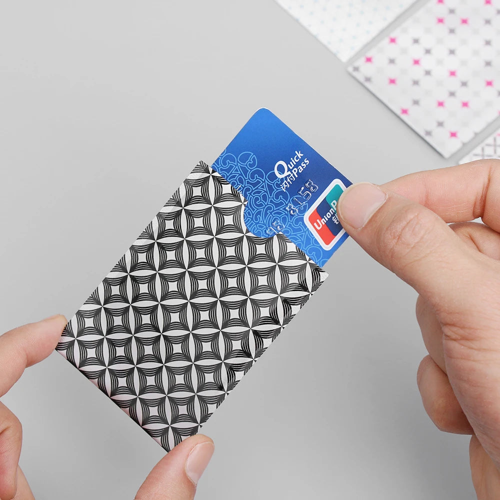 Patterned RFID blocking card sleeve with a contactless card — image 1